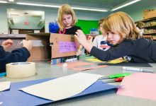 Students making a prototype for a penguin nesting box as part of a maker project