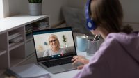 Teenage girl participating in a video chat with her teacher