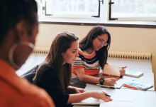 Teachers meeting in classroom