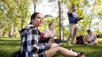 Photo of high school students outside with teacher