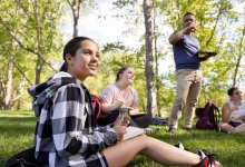 Photo of high school students outside with teacher