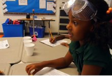 A girl student is in a science class.