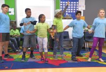 A group of students are having fun in a classroom.