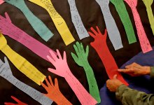 Elementary school teacher working on hallway bulletin board