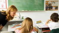 Photo of teacher speaking with student