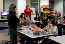 Two teachers instructing a high school class