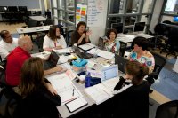 Teachers meeting in a classroom