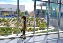 Student stands at a window at Design39.