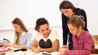 Photo of high school teacher with students