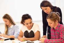 Photo of high school teacher with students