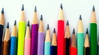 a row of colored pencils