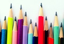 a row of colored pencils