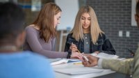 Two high school students working together in class