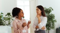 Two women talking to each other