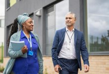 Two adults walking and talking