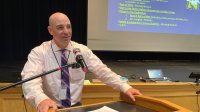 Principal Hugh Galligan leading a school assembly