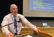 Principal Hugh Galligan leading a school assembly