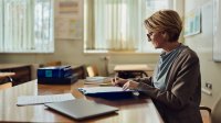 Teacher grading at her desk