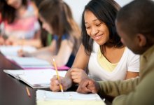 Two high school students working together