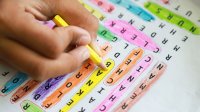 Child filling out a word search activity