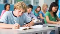 High school students taking notes in class