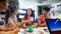 High school students working in class together