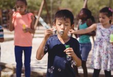 Children blowing bubbles