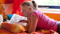 Teen reading a graphic novel