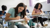 High school students writing at their desks