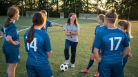 Soccer coach talking to team