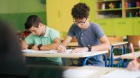 High school students writing at their desks