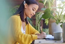 Woman writing in a journal