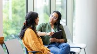 Two women sitting and talking