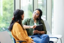 Two women sitting and talking