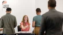 Teenager volunteering at a polling location