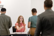 Teenager volunteering at a polling location