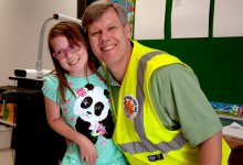 Dad and daughter together smiling