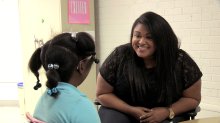 A teacher and student meeting at Fall Hamilton Elementary School.