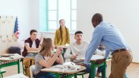 Photo of high school teacher with students