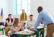 Photo of high school teacher with students