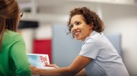 Two teachers meet in classroom