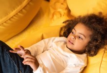 Child laying on bean bags