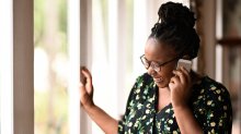 Woman laughing while talking on the phone