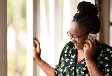 Woman laughing while talking on the phone