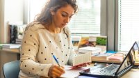 Teacher works at her desk