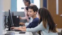 Middle school students work on computer