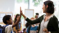 Photo of teacher greeting student