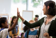 Photo of teacher greeting student