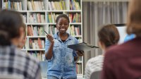 High school student gives presentation in class