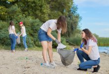 Teens clean up beach for community service.